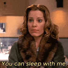 a woman in a fur coat with the words you can sleep with me below her