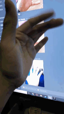 a close up of a person 's hand in front of a computer screen that says " general "