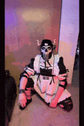 a person dressed in a maid outfit with a skull mask on