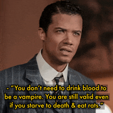 a man in a suit and tie with a quote that says " you don 't need to drink blood to be a vampire "