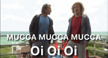 two men standing next to each other with the words mucca mucca mucca oi oi oi