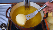 Frying A Donut A Knead To Bake GIF - Frying A Donut A Knead To Bake Deep Frying GIFs