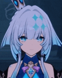 a girl with a crown on her head is wearing a blue dress and a necklace .
