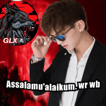 a man wearing sunglasses stands in front of a logo for glx with a wolf in the background