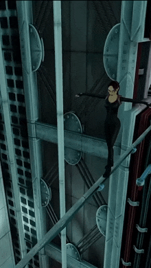 a woman in a black suit is walking on a tightrope in a dark room