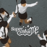 a group of people are jumping in the air in front of a sign that says super realite .