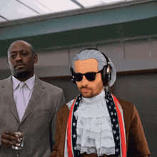 a man in a suit and tie stands next to a man in a costume