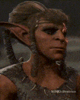 a close up of a person 's face with nemo-beatrice written below it