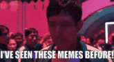 a man in a crowd says i 've seen these memes before .