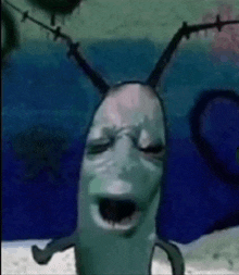 a cartoon character from spongebob squarepants is making a funny face while standing in the water .