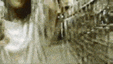 a blurred image of a person walking down a hallway