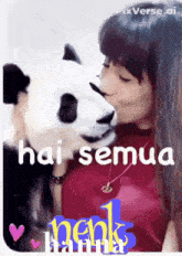 a picture of a woman kissing a panda bear with the words hai semua