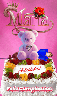 a teddy bear sits on top of a cake that says maria