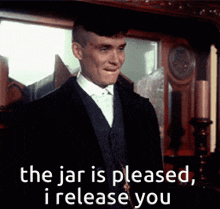a man in a suit says " the jar is pleased , i release you "