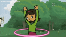 a girl in a green sweater is playing with a pink hula hoop ..