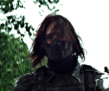 a close up of a man wearing a mask that says ' s.h.i.e.l.d ' on it