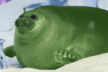 a green seal that looks like a cartoon character