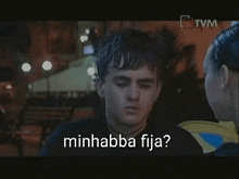 a man and a woman are talking to each other and the man is asking the woman 's name in a foreign language .