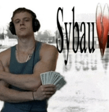 a man wearing headphones is holding a fan of money in front of sybau