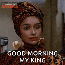 a woman wearing a head scarf and earrings says good morning my king