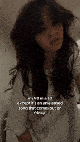 a woman with long hair is wearing a white shirt that says my 90 in a 30