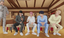 a group of men in pajamas are sitting in a row