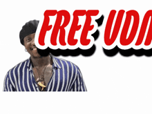 a man in a striped shirt is smiling in front of a sign that says free ud