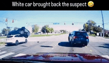a white car brought back the suspect while driving down a street