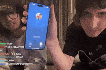 a man holding a cell phone with a blue screen that says sign message on it