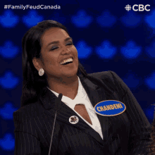 a woman wearing a name tag that says chandeni on it