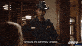 a man in a sheriff 's uniform is talking about tampons
