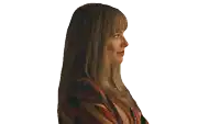 a woman in a striped shirt is smiling and looking to the side