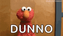 elmo from sesame street is standing in front of a wall and saying dunny .