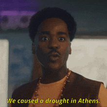 a close up of a man with the words we caused a drought in athens below him
