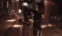 a man and a woman are dancing in a dark room .