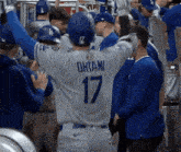 a baseball player wearing a number 17 jersey