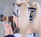 a woman wearing a headband that says uc on it