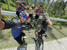 a group of cyclists are posing for a picture and one of them has a shirt that says bora