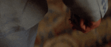 a person is holding a knife in their hand in a blurry photo