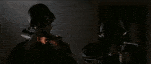a close up of a fire with smoke coming out of it in a dark room .