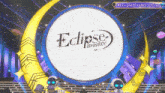 a stage with a eclipse breaker logo in the center