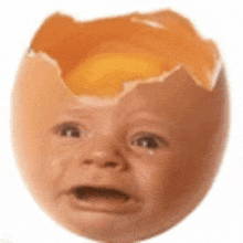 a cracked egg with a baby face on it