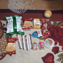 a bunch of snacks on a bed including one that says french