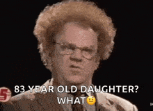 a man with curly hair and glasses is asking a question about his daughter .