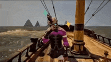 a man in a purple outfit is standing on a boat in the ocean .