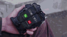 a person is holding a cell phone that has a call waiting on the screen