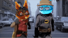 a cartoon of a cat and a batman standing next to each other