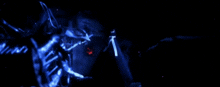 a person in a mask is standing in a dark room with a blue light behind them