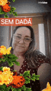 a woman with glasses is surrounded by flowers and a sign that says sem dada on it