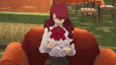 a girl with red hair is sitting in a chair holding a cup of tea